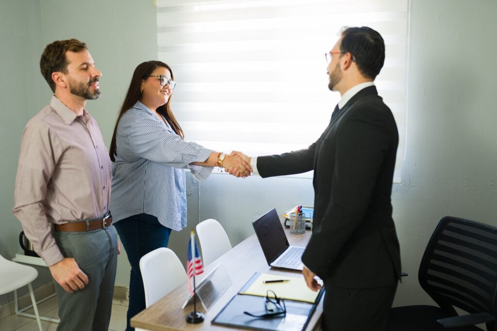Happy,Couple,Meeting,Legal,Advisor,For,Immigration,Process,,Receiving,Professional